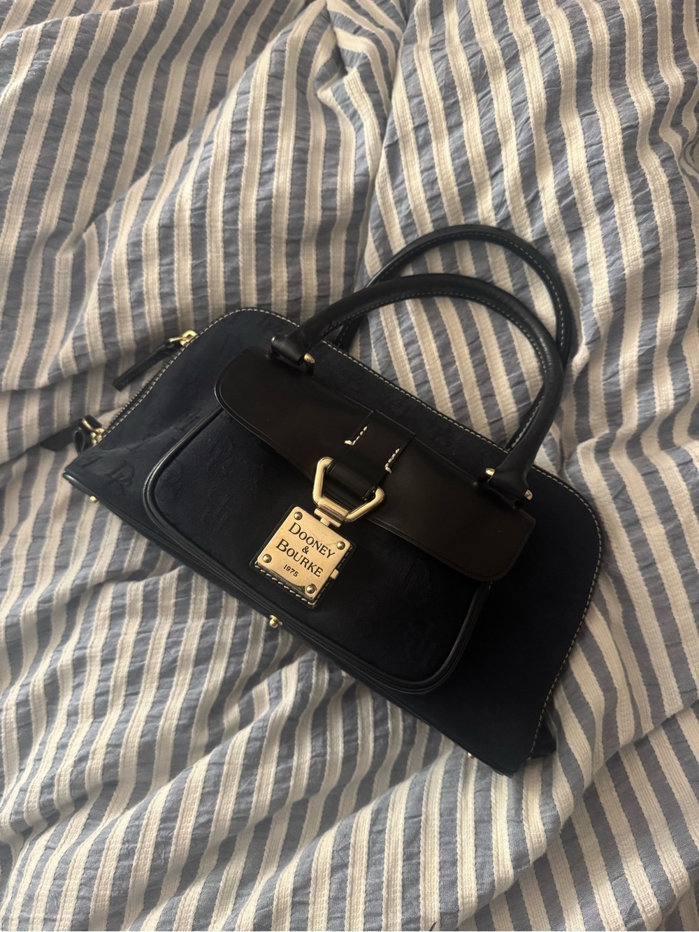 Dooney & Bourke black Satchel with Gold Plate Accent